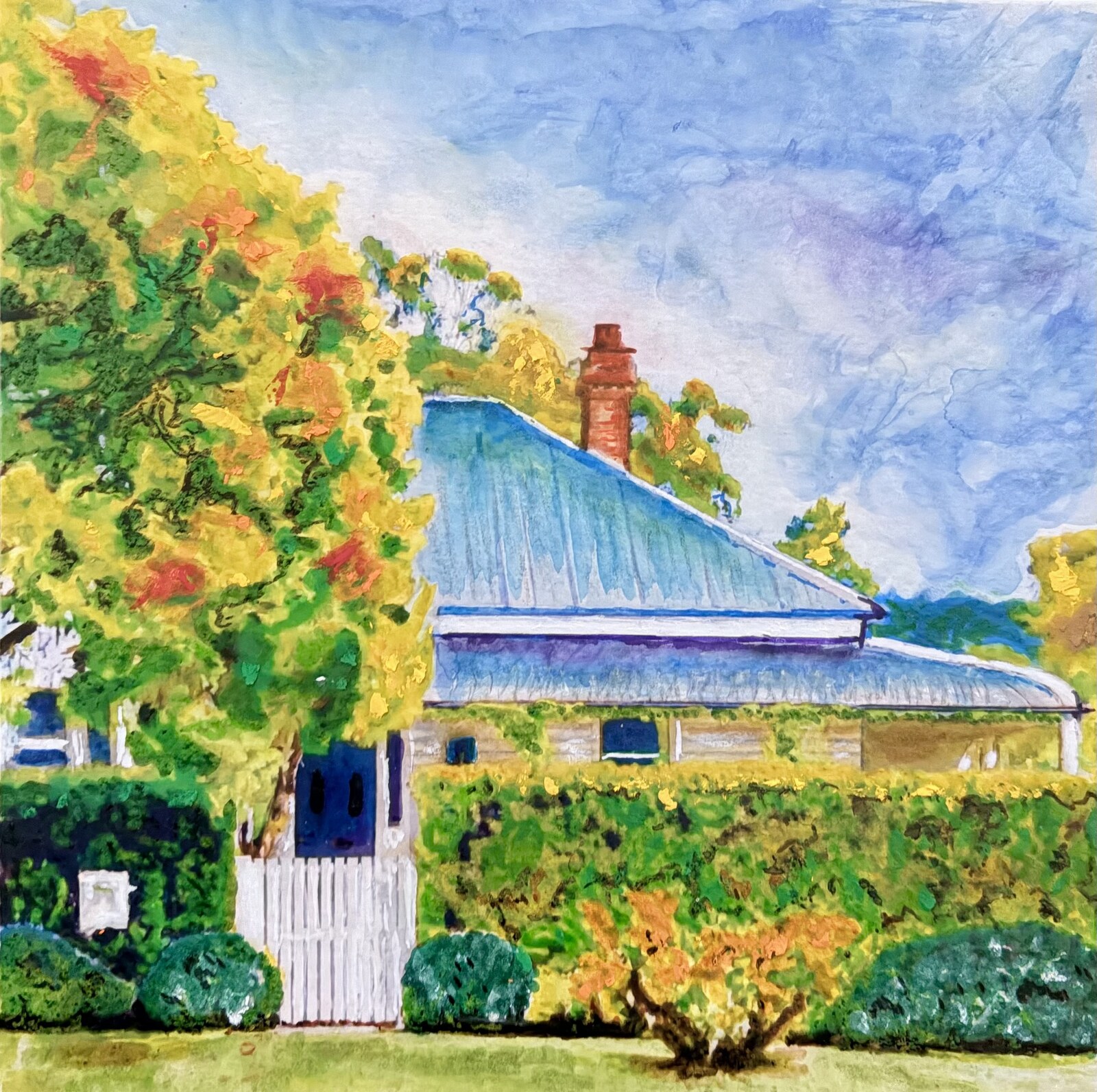 Golden autumn cottage with blue roof and white gate